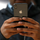 A customer checks out the iPhone X at an Apple store right after the phone was released